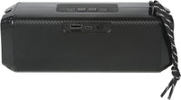 Black portable speaker with USB and audio jack ports on a white background