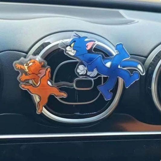 Car air freshener with cartoon characters on a car dashboard