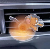 Cartoon mouse character on a car air vent