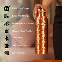 Copper water bottle held by a person with health benefits listed on a blurred background