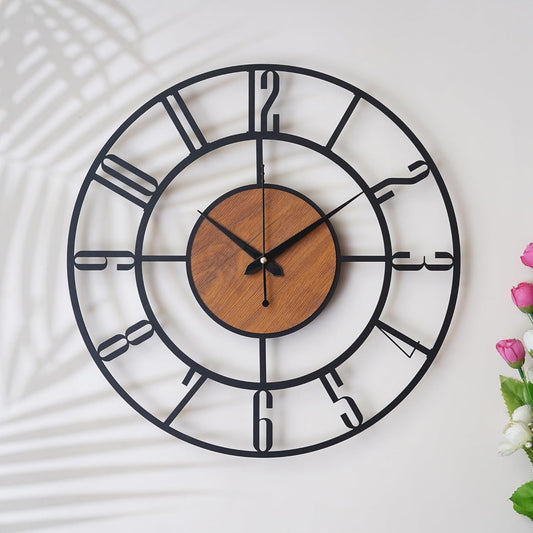Decorative wall clock with black metal frame and wooden center on a white background
