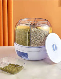 Food dispenser with compartments filled with food on a table.