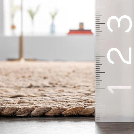 Rug with a ruler for scale on a neutral background