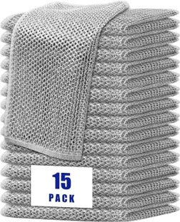 Stack of gray towels with a '15 Pack' label on a white background