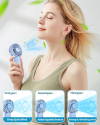 Woman using a handheld fan with speed indicators on a light background