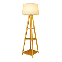Wooden floor lamp with a beige shade on a white background