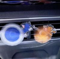 Car air freshener with cartoon characters on a car vent