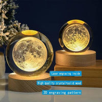 Two moon-shaped night lights on wooden bases with decorative text about their features.