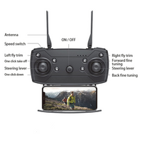 Black drone remote control with labeled components and a smartphone displaying a video feed.